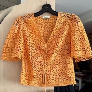 Sandro lace-pattern orange crop top, new and never worn, size 2